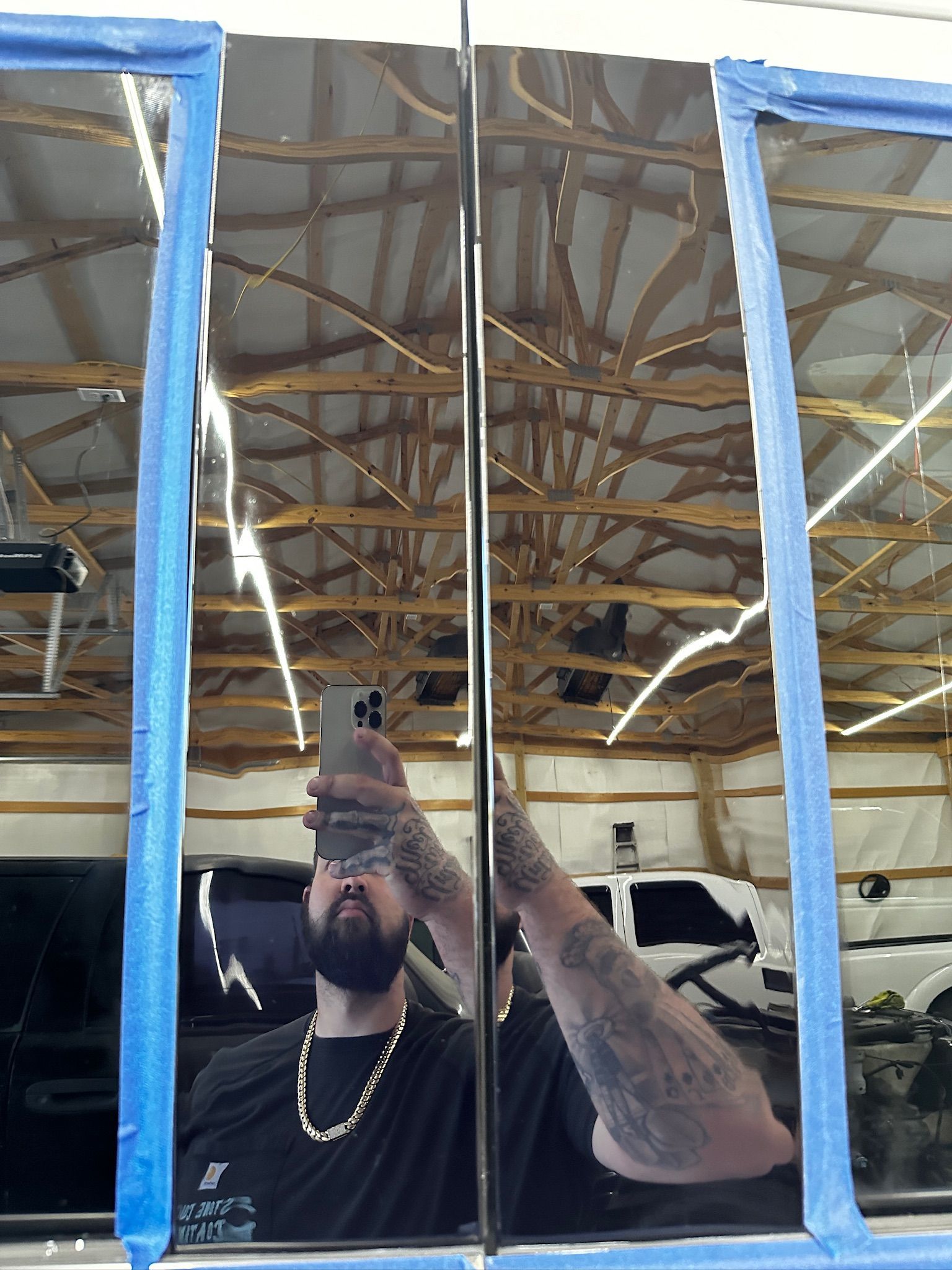 A man is taking a picture of himself in a mirror.